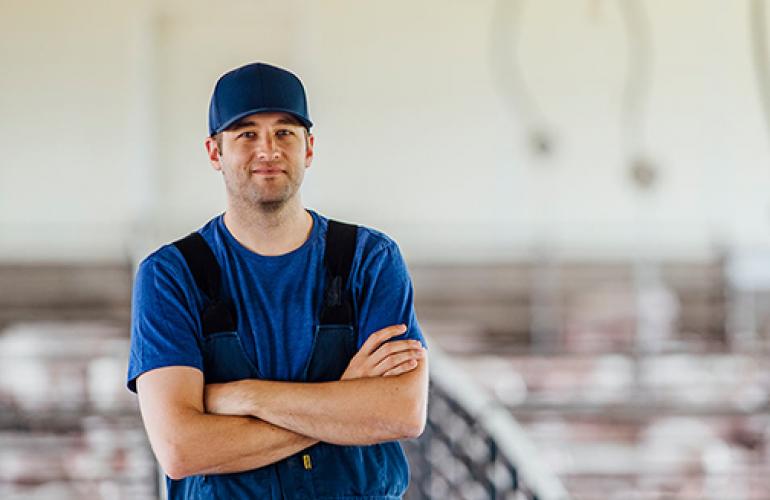 Swine production staff smiling